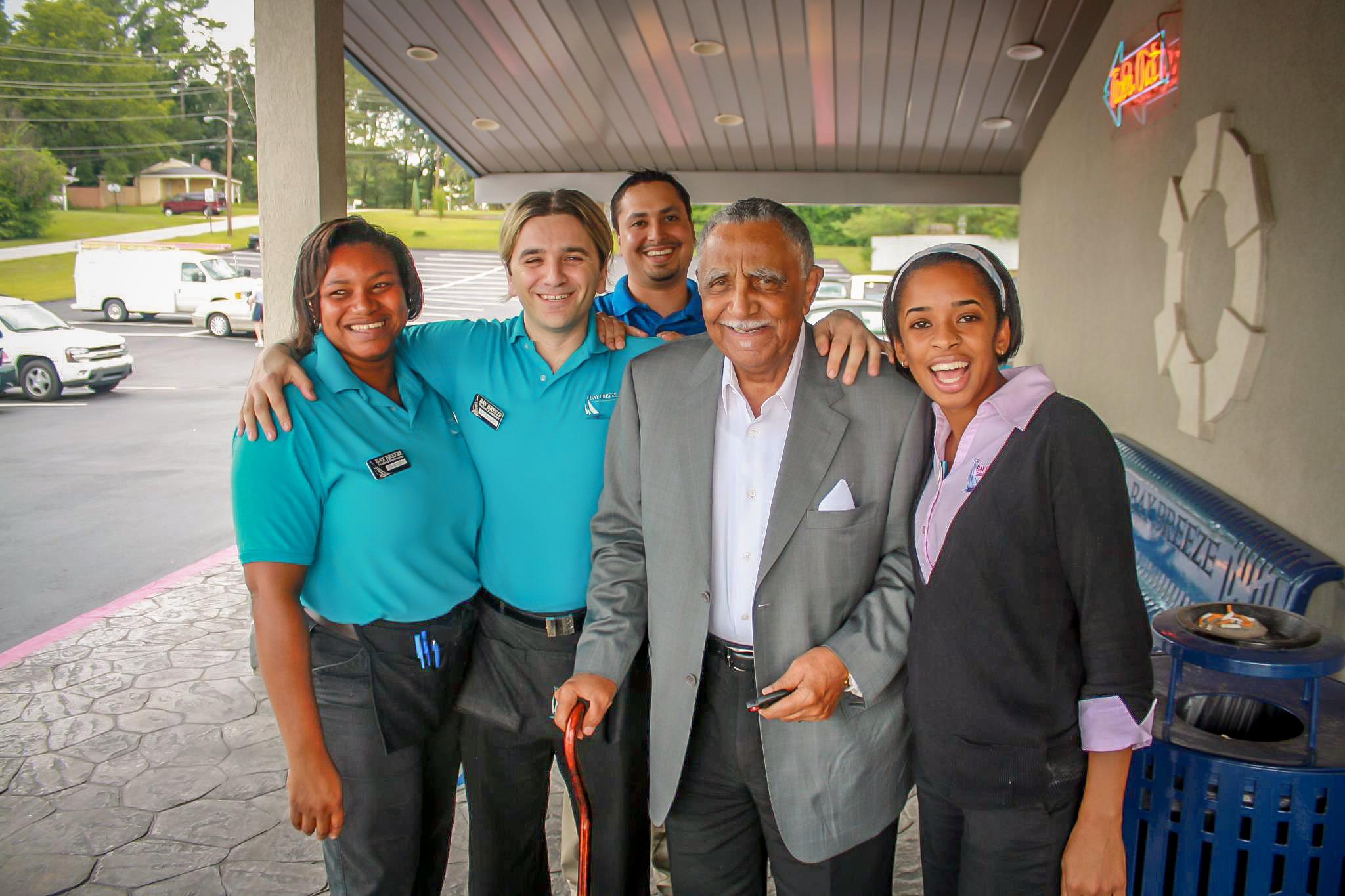 Joshua Lowery with Bay Breeze Seafood staff outside the restaurant